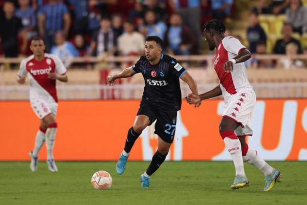 Monaco, Monaco, 6th October 2022. Trezeguet of Trabzonspor takes n Axel Disasi of AS Monaco during the UEFA Europa League match at Stade Louis II, Monaco. Picture credit should read: Jonathan Moscrop Sportimage EDITORIAL USE ONLY. No use with unauthorised audio, video, data, fixture lists, club league logos or live services. Online in-match use limited to 120 images, no video emulation. No use in betting, games or single club league player publications. SPI-1903-0002