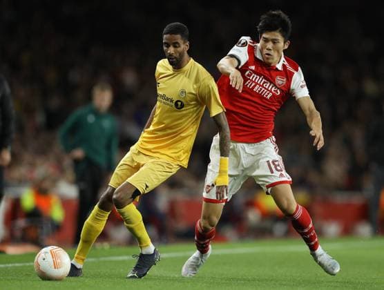 London, England, 6th October 2022. Takehiro Tomiyasu of Arsenal and Amahl Pellegrino of Bodo Glimt challenge for the ball during the UEFA Europa League match at the Emirates Stadium, London. Picture credit should read: Paul Terry Sportimage EDITORIAL USE ONLY. No use with unauthorised audio, video, data, fixture lists, club league logos or live services. Online in-match use limited to 120 images, no video emulation. No use in betting, games or single club league player publications. SPI-1926-0010