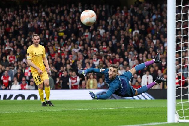 Mandatory Credit: Photo by Simon Dael Shutterstock (13442648v) Nikita Khaikin of Bodø Glimt is beaten by the shot of Kieran Tierney of Arsenal but hits the post Arsenal v Bodo Glimt, UEFA Europa League, Group A, Football, Emirates Stadium, London, UK - 06 Oct 2022 EDITORIAL USE ONLY No use with unauthorised audio, video, data, fixture lists, club league logos or live services. Online in-match use limited to 120 images, no video emulation. No use in betting, games or single club league player publications. Arsenal v Bodo Glimt, UEFA Europa League, Group A, Football, Emirates Stadium, London, UK - 06 Oct 2022 EDITORIAL USE ONLY No use with unauthorised audio, video, data, fixture lists, club league logos or live services. Online in-match use limited to 120 images, no video emulation. No use in betting, games or single club league player publications.  Copyright: xSimonxDael Shutterstockx 13442648v