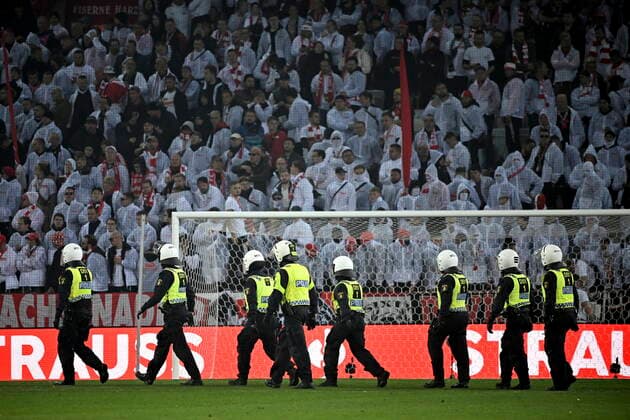Riot police arrest and take away a person after supporters set off fireworks on both the pitch and the stands during Thursday s Europa League, Group D football match between Malmö FF and FC Union Berlin at Eleda Stadium, Malmo, Sweden, 6 October 2022 Malmo Sweden FOTBOLL x50090x