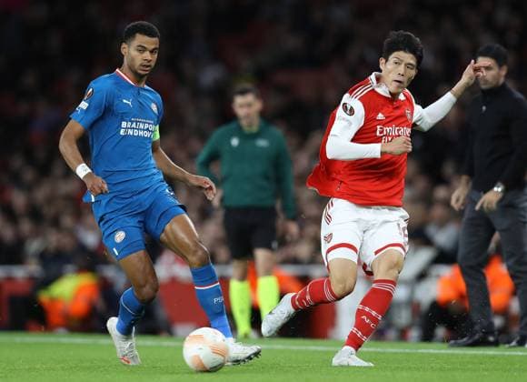 London, England, 20th October 2022. Takehiro Tomiyasu of Arsenal and Cody Gakpo of PSV Eindhoven challenge for the ball during the UEFA Europa League match at the Emirates Stadium, London. Picture credit should read: Paul Terry Sportimage EDITORIAL USE ONLY. No use with unauthorised audio, video, data, fixture lists, club league logos or live services. Online in-match use limited to 120 images, no video emulation. No use in betting, games or single club league player publications. SPI-1970-0006