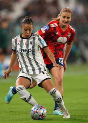 Turin, Italy, 27th October 2022. Lisa Boattin of Juventus is pursued by Lindsey Horan of Lyon during the UEFA Womens Champions League match at Juventus Stadium, Turin. Picture credit should read: Jonathan Moscrop Sportimage EDITORIAL USE ONLY. No use with unauthorised audio, video, data, fixture lists, club league logos or live services. Online in-match use limited to 120 images, no video emulation. No use in betting, games or single club league player publications. SPI-1984-0001
