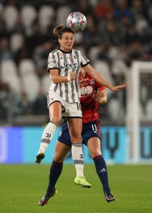 Turin, Italy, 27th October 2022. Cristiana Girelli of Juventus heads on from Damaris Egurrola of Lyon during the UEFA Womens Champions League match at Juventus Stadium, Turin. Picture credit should read: Jonathan Moscrop Sportimage EDITORIAL USE ONLY. No use with unauthorised audio, video, data, fixture lists, club league logos or live services. Online in-match use limited to 120 images, no video emulation. No use in betting, games or single club league player publications. SPI-1984-0012