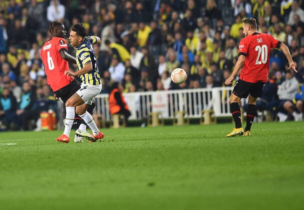 Irfan Can Kahveci of Fenerbahce and Chimuanya Ugochukwu 6 of Stade Rennes during the UEFA Europa League group B match between Fenerbahce and Stade Rennes at Ulker Sukru Saracoglu Stadium in Istanbul, Turkey on October 27, 2022. ( Photo by Seskimphoto ) 