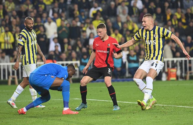 Attila Szalai (R) of Fenerbahce and Goalkeeper Steve Mandanda , Adrien Truffert 3 of Stade Rennes during the UEFA Europa League group B match between Fenerbahce and Stade Rennes at Ulker Sukru Saracoglu Stadium in Istanbul, Turkey on October 27, 2022. ( Photo by Seskimphoto ) 