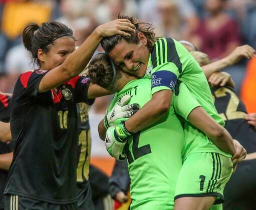 Germany s goalie Nadine Angerer, right, embraces their back-up goalie Almuth Schult, middle, after the victory by 1-0 in the UEFA Women s Euro soccer final between Germany and Norway at the Friends Arena in Stockholm on July 28, 2013. STOCKHOLM SWEDEN - xx