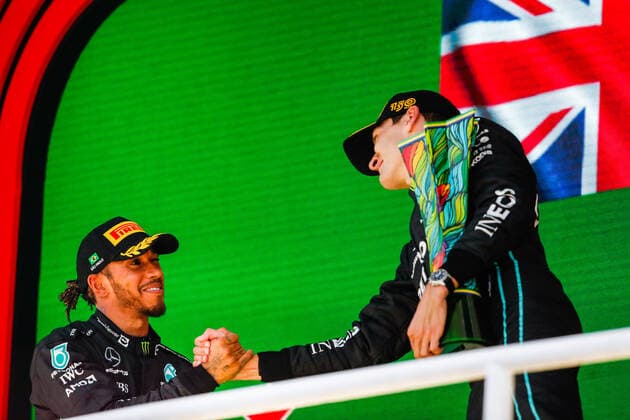 RUSSELL George (gbr), Mercedes AMG F1 Team W13, portrait celebrating his first win on the podium with HAMILTON Lewis (gbr), Mercedes AMG F1 Team W13, during the Formula 1 Heineken Grande Premio de Sao Paulo 2022, Sao Paulo Grand Prix Grand Prix 2022, 21st round of the 2022 FIA Formula One World Championship, WM, Weltmeisterschaft from November 11 to 13, 2022 on the Interlagos Circuit, in Sao Paulo, Brazil - F1 - SAO PAULO GRAND PRIX 2022 - RACE DPPI Panoramic 00122048__V2_2147