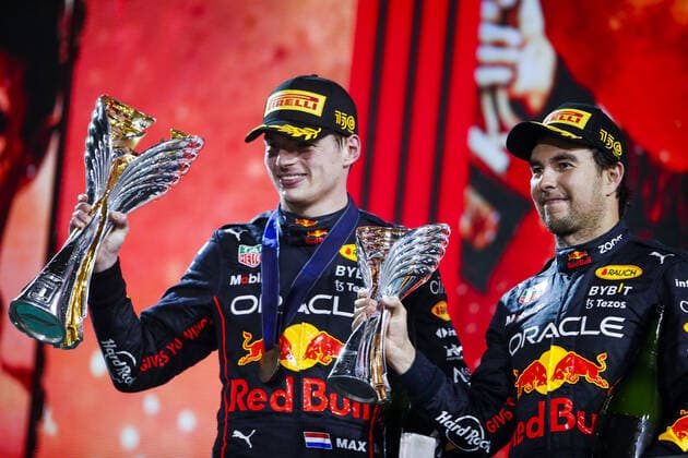 VERSTAPPEN Max (ned), Red Bull Racing RB18, PEREZ Sergio (mex), Red Bull Racing RB18, portrait on the podium during the Formula 1 Etihad Airways Abu Dhabi Grand Prix 2022, 22nd round of the 2022 FIA Formula One World Championship, WM, Weltmeisterschaft from November 18 to 20, 2022 on the Yas Marina Circuit, in Yas Island, Abu Dhabi - F1 - ABU DHABI GRAND PRIX 2022 - RACE DPPI Panoramic  00122050__V2_7614.JPG