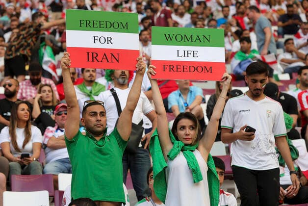Sport Themen der Woche KW47 England v Iran 2022 FIFA World Cup, WM, Weltmeisterschaft, Fussball Iran fans hold Freedom For Iran and Women Life Freedom placards before the 2022 FIFA World Cup Group B match at Khalifa International Stadium, Al-Rayyan Content Not Available For UK Newspapers Copyright: xPaulxChestertonx FIL-17628-0029 UK Newspapers OUT
