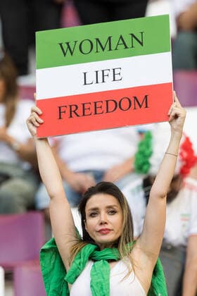 England v Iran: Group B - FIFA World Cup, WM, Weltmeisterschaft, Fussball Qatar 2022 Iran fans holding a banner Woman Life Freedom during the World Cup match between England v Iran, in Doha, Qatar, on November 21, 2022. Doha Qatar  Copyright: xFotoxOlimpikx originalFilename:jastrzebowski-englandv221120_npBus.jpg