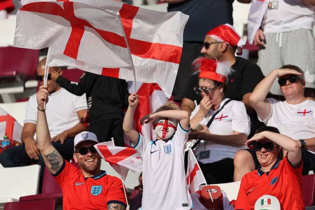QATAR, DOHA - NOVEMBER 21, 2022: Team England supporters wave flags ahead of the 2022 FIFA World Cup, WM, Weltmeisterschaft, Fussball Group B football match between England and Iran at Khalifa International Stadium. Sergei Bobylev TASS  56004954