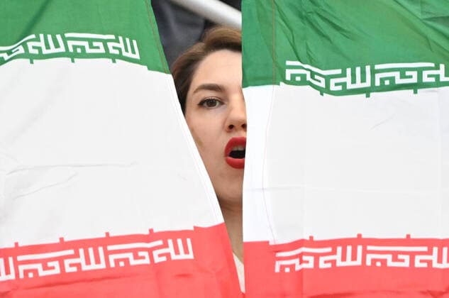 (221121) -- DOHA, Nov. 21, 2022 -- A fan is seen inside the stadium before the Group B match between England and Iran at the 2022 FIFA World Cup, WM, Weltmeisterschaft, Fussball at Khalifa International Stadium in Doha, Qatar, Nov. 21, 2022. ) (SP)QATAR-DOHA-2022 WORLD CUP-GROUP B-ENG VS IRN LixGa 