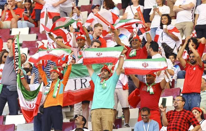 Football World Cup in Qatar Fans hold up Iranian flags in the stands prior to the start of a World Cup Group B football game against England at Khalifa International Stadium in Doha, Qatar on Nov. 21, 2022.  A14AA0001359740P 