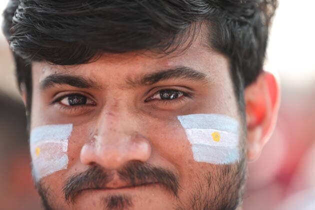 QATAR, DOHA - NOVEMBER 22, 2022: A supporter of Team Argentina watches a 2022 FIFA World Cup, WM, Weltmeisterschaft, Fussball Group C football match between Argentina and Saudi Arabia shown on a giant screen at central Doha s FIFA fan festival. Sergei Bobylev TASS  56023399