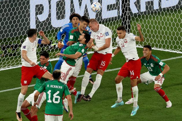 Mexico v Poland 22 November 2022 - FIFA World Cup, WM, Weltmeisterschaft, Fussball - Group C - Mexico v Poland - a collision of heads between Cesar Montes of Mexico and Kamil Glik of Poland in the penalty area - Photo: Charlotte Wilson Offside. Doha Qatar Copyright: xCharlottexWilsonx xOffsidexOffside