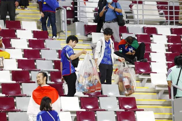 Football World Cup in Qatar Japanese supporters clean up litter at Khalifa International Stadium after Japan defeated Germany in a World Cup Group E football match in Doha, Qatar, on Nov. 23, 2022.  A14AA0001361293P 