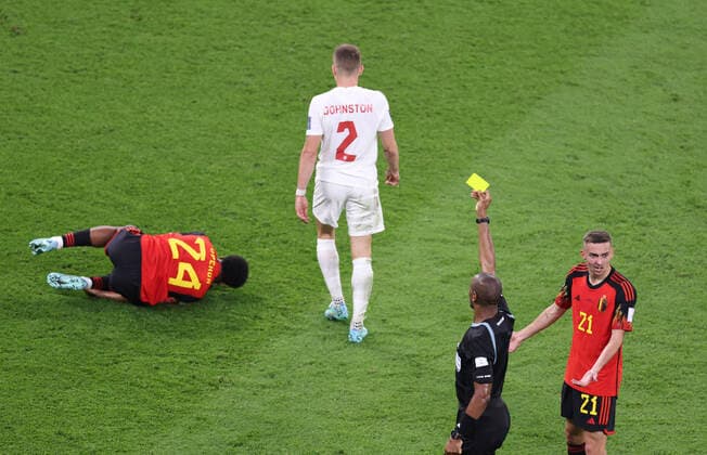 (221123) -- AL RAYYAN, Nov. 23, 2022 -- Referee Janny Sikazwe (2nd R) gives a yellow card to Alistair Johnston (2nd L) of Canada during the Group F match between Belgium and Canada at the 2022 FIFA World Cup, WM, Weltmeisterschaft, Fussball at Ahmad Bin Ali Stadium in Al Rayyan, Qatar, Nov. 23, 2022. ) (SP)QATAR-AL RAYYAN-2022 WORLD CUP-GROUP F-BEL VS CAN XuxZijian 