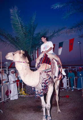 American tennis player Pete Sampras riding a camel, Qatar 1990s 