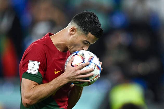 (221124) -- DOHA, Nov. 24, 2022 -- Cristiano Ronaldo of Portugal kisses the ball before a penalty kick during the Group H match between Portugal and Ghana at the 2022 FIFA World Cup, WM, Weltmeisterschaft, Fussball at Ras Abu Aboud (974) Stadium in Doha, Qatar, Nov. 24, 2022. ) (SP)QATAR-DOHA-FOOTBALL-2022 WORLD CUP-GROUP H-POR VS GHA XiaoxYijiu 