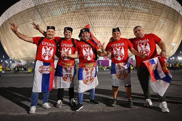 Qatar Soccer World Cup Brazil - Serbia 8324053 24.11.2022 Serbia s fans pose for a photo before the start of the Qatar 2022 World Cup Group G soccer match between Brazil and Serbia at the Lusail Stadium in Lusail, Qatar. Grigory Sysoev Sputnik Lusail Qatar  Copyright: xGrigoryxSysoevx