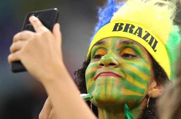 Doha, Qatar, 24th November 2022. Brazil fan paints her face during the FIFA World Cup, WM, Weltmeisterschaft, Fussball 2022 match at Lusail Stadium, Doha. Picture credit should read: David Klein Sportimage EDITORIAL USE ONLY. No use with unauthorised audio, video, data, fixture lists, club league logos or live services. Online in-match use limited to 120 images, no video emulation. No use in betting, games or single club league player publications. SPI-2063-0017