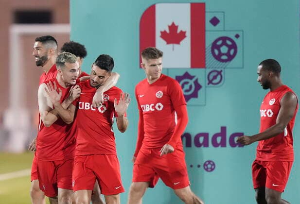 November 25, 2022, DOHA, QATAR: Canada forward Liam Millar, left, jokes around with Canada midfielder Stephen Eustaquio, second left, during practice at the World Cup in Doha, Qatar, Friday, Nov. 25, 2022. Canada News - November 25, 2022 - ZUMAc35_ 20221125_zaf_c35_039 Copyright: xNathanxDenettex