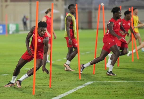 November 26, 2022, DOHA, QATAR: Canada forward Alphonso Davies, left, run a drill during practice at the World Cup in Doha, Qatar on Saturday, November 26, 2022. Canada News - November 26, 2022  - ZUMAc35_ 20221126_zaf_c35_017 Copyright: xNathanxDenettex