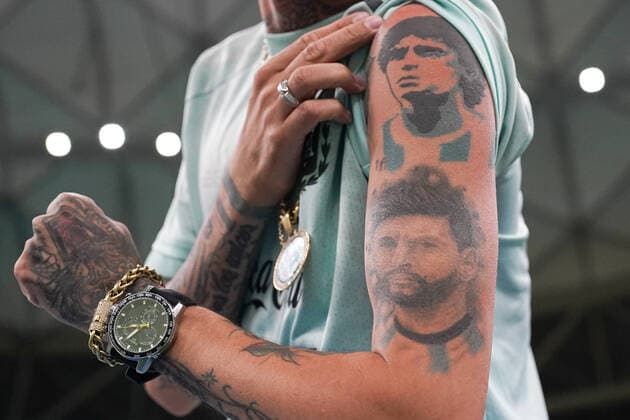 LUSAIL, QATAR - NOVEMBER 26: Fan of Argentina shows his tattoo of Messi and Diego Maradona prior to the FIFA World Cup, WM, Weltmeisterschaft, Fussball Qatar 2022 group A match between Argentina and Mexico at Khalifa International Stadium on November 26, 2022 in Doha, Qatar. (Photo by Florencia Tan Jun PxImages Icon Sportswire) SOCCER: NOV 26 FIFA World Cup - Mexico v Argentina Icon221126049