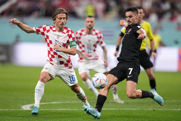 (221127) -- DOHA, Nov. 27, 2022 -- Luka Modric (L) of Croatia vies with Stephen Eustaquio of Canada during the Group F match between Croatia and Canada at the 2022 FIFA World Cup, WM, Weltmeisterschaft, Fussball at Khalifa International Stadium in Doha, Qatar, Nov. 27, 2022. ) (SP)QATAR-DOHA-2022 WORLD CUP-GROUP F-CRO VS CAN MengxDingbo 