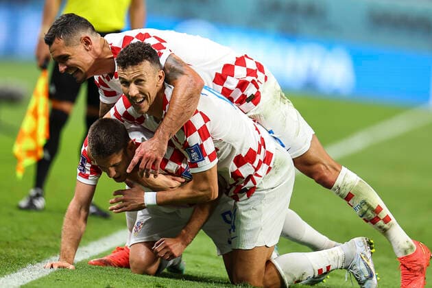 (221127) -- DOHA, Nov. 27, 2022 -- Andrej Kramaric (Bottom) of Croatia celebrates for his goal with his teammates during the Group F match between Croatia and Canada at the 2022 FIFA World Cup, WM, Weltmeisterschaft, Fussball at Khalifa International Stadium in Doha, Qatar, Nov. 27, 2022. ) (SP)QATAR-DOHA-2022 WORLD CUP-GROUP F-CRO VS CAN DingxXu 
