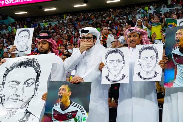 Mandatory Credit: Photo by Javier Garcia Shutterstock (13634885y) Fans protest with pictures of Mesut Ozil Spain v Germany, FIFA World Cup, WM, Weltmeisterschaft, Fussball 2022, Group E, Football, Al Bayt Stadium, Al Khor, Qatar - 27 Nov 2022 Editorial Use Only Spain v Germany, FIFA World Cup 2022, Group E, Football, Al Bayt Stadium, Al Khor, Qatar - 27 Nov 2022 Editorial Use Only  Copyright: xJavierxGarcia Shutterstockx 13634885y