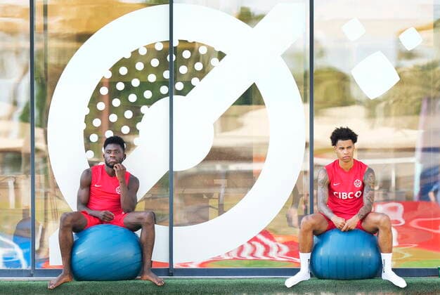 November 28, 2022, DOHA, QATAR: Canada forward Alphonso Davies, left, and teammate Canada forward Tajon Buchanan watch during practice at the World Cup in Doha, Qatar on Monday, November 28, 2022. Canada News - November 28, 2022  - ZUMAc35_ 20221128_zaf_c35_001 Copyright: xNathanxDenettex