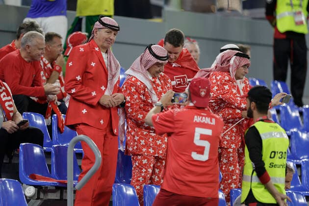 Fans of Switzerland attend a FIFA World Cup, WM, Weltmeisterschaft, Fussball soccer match of the group phase between Brazil and Switzerland at 974 stadium in Doha, Qatar, 28 November 2022. World Cup 2022: Brazil and Switzerland !ACHTUNG: NUR REDAKTIONELLE NUTZUNG!  Copyright: xJJxGuillénx GR1054 20221128-d8c7bbaad80ee6832660ea64c124790352f87db6