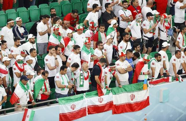 Football World Cup in Qatar Iran supporters look dejected after Iran failed to qualify for the Round of 16 following a 1-0 loss to the United States in a World Cup Group B football match at Al Thumama Stadium in Doha, Qatar, on Nov. 30, 2022.  A14AA0001366684P 