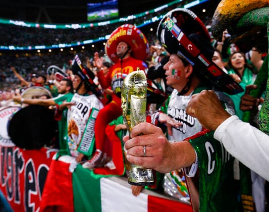 Saudi Arabia v Mexico 2022 FIFA World Cup, WM, Weltmeisterschaft, Fussball Detail shot of a replica World Cup Trophy in a Mexico fans hand before the 2022 FIFA World Cup Group C match at Lusail Stadium, Lusail Content Not Available For UK Newspapers Copyright: xPaulxChestertonx FIL-17655-0040 UK Newspapers OUT