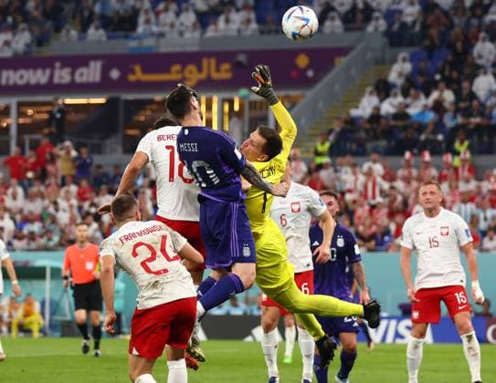 Doha, Qatar, 30th November 2022. Wojciech Szczesny of Poland falls into Lionel Messi of Argentina from which Var asked the referee to take a look at the video replay during the FIFA World Cup, WM, Weltmeisterschaft, Fussball 2022 match at Stadium 974, Doha. Picture credit should read: David Klein Sportimage EDITORIAL USE ONLY. No use with unauthorised audio, video, data, fixture lists, club league logos or live services. Online in-match use limited to 120 images, no video emulation. No use in betting, games or single club league player publications. SPI-2075-0059