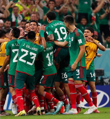 Saudi Arabia v Mexico 2022 FIFA World Cup, WM, Weltmeisterschaft, Fussball Luis Chavez (hidden) is swamped by his team-mates after scoring Mexicos second goal during the 2022 FIFA World Cup Group C match at Lusail Stadium, Lusail Content Not Available For UK Newspapers Copyright: xPaulxChestertonx FIL-17655-0126 UK Newspapers OUT