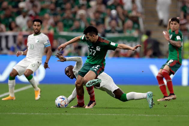 Saud Abdulhamid (down) of Saudi Arabia vies for the ball with Hirving Lozano of Mexico during a FIFA World Cup, WM, Weltmeisterschaft, Fussball soccer match of the group phase between Saudi Arabia and Mexico at Lusail stadium, Qatar 30 November 2022. World Cup 2022: Saudi Arabia vs. Mexico !ACHTUNG: NUR REDAKTIONELLE NUTZUNG!  Copyright: xAntonioxLacerdax GR3229 20221130-d7f266ea673d3284ae69c84b13c5a77c4006ef8e