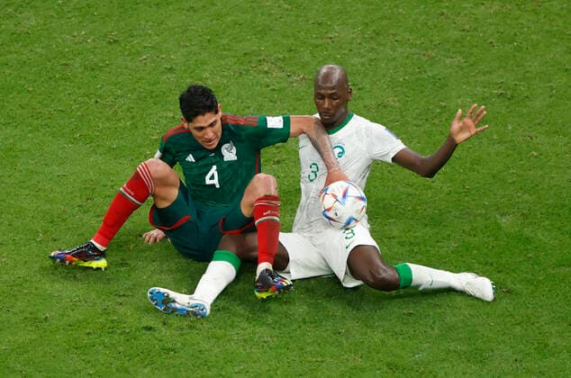 Abdullah Madu (R) of Saudi Arabia vies for the ball with Edson Alvarez of Mexico during a group stage match of the Qatar 2022 Soccer World Cup between Saudi Arabia and Mexico at the Lusail stadium, Qatar 30 November 2022. Soccer World Cup: Saudi Arabia - Mexico !ACHTUNG: NUR REDAKTIONELLE NUTZUNG!  Copyright: xEstebanxBibax GR3449 20221130-260fbab3a4d19a66b4d114a53fc2eec8a239a244