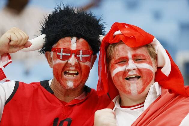 Football World Cup in Qatar Fans with their faces painted in colors of the Danish flag pose for a photo before a World Cup Group D football match between Australia and Denmark at Al Janoub Stadium in Al Wakrah, Qatar on Nov. 30, 2022.  A14AA0001367579P 