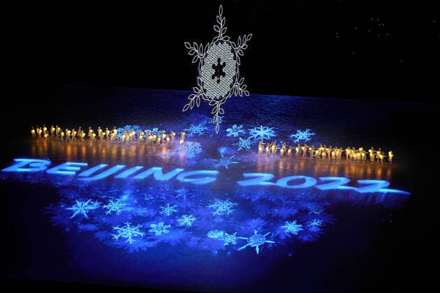 A group of children holding snowflake lanterns dance on ice at the Olympic Closing Ceremonies in National Stadium at the Beijing 2022 Winter Olympics on Sunday, February 20, 2022.  POY2022S117 PaulxHanna