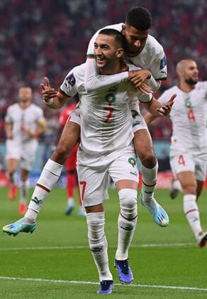 (221201) -- DOHA, Dec. 1, 2022 -- Hakim Ziyech (front) of Morocco celebrates after scoring during the Group F match between Canada and Morocco at the 2022 FIFA World Cup, WM, Weltmeisterschaft, Fussball at Al Thumama Stadium in Doha, Qatar, Dec. 1, 2022. ) (SP)QATAR-DOHA-2022 WORLD CUP-GROUP F-CAN VS MAR ChenxCheng 