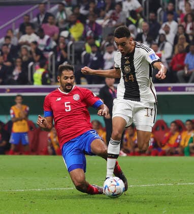 Costa Rica v Germany 2022 FIFA World Cup, WM, Weltmeisterschaft, Fussball Celso Borges of Costa Rica tackles Jamal Musiala of Germany during the 2022 FIFA World Cup Group E match at Al Bayt Stadium, Al Bayt Content Not Available For UK Newspapers Copyright: xPaulxChestertonx FIL-17657-0083 UK Newspapers OUT