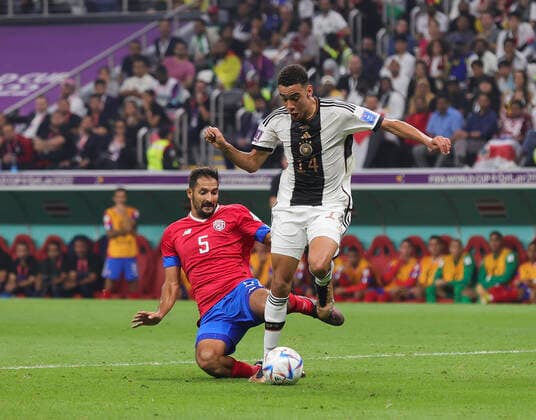 Costa Rica v Germany 2022 FIFA World Cup, WM, Weltmeisterschaft, Fussball Celso Borges of Costa Rica tackles Jamal Musiala of Germany during the 2022 FIFA World Cup Group E match at Al Bayt Stadium, Al Bayt Content Not Available For UK Newspapers Copyright: xPaulxChestertonx FIL-17657-0084 UK Newspapers OUT