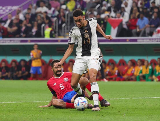 Costa Rica v Germany 2022 FIFA World Cup, WM, Weltmeisterschaft, Fussball Celso Borges of Costa Rica tackles Jamal Musiala of Germany during the 2022 FIFA World Cup Group E match at Al Bayt Stadium, Al Bayt Content Not Available For UK Newspapers Copyright: xPaulxChestertonx FIL-17657-0085 UK Newspapers OUT