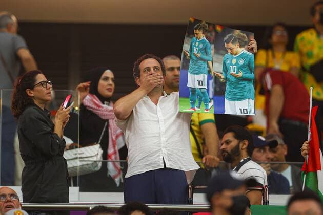 Mandatory Credit: Photo by Kieran McManus Shutterstock (13640390ab) Fans hold up a picture of German football player Mesut Ozil Costa Rica v Germany, FIFA World Cup, WM, Weltmeisterschaft, Fussball 2022, Group E, Football, Al Bayt Stadium, Al Khor, Qatar - 01 Dec 2022 Editorial Use Only Costa Rica v Germany, FIFA World Cup 2022, Group E, Football, Al Bayt Stadium, Al Khor, Qatar - 01 Dec 2022 Editorial Use Only  Copyright: xKieranxMcManus Shutterstockx 13640390ab