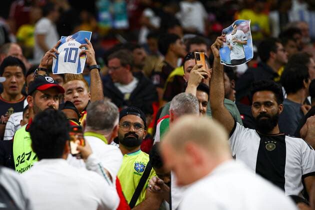 Mandatory Credit: Photo by Kieran McManus Shutterstock (13640390ac) Fans hold up a picture of German football player Mesut Ozil Costa Rica v Germany, FIFA World Cup, WM, Weltmeisterschaft, Fussball 2022, Group E, Football, Al Bayt Stadium, Al Khor, Qatar - 01 Dec 2022 Editorial Use Only Costa Rica v Germany, FIFA World Cup 2022, Group E, Football, Al Bayt Stadium, Al Khor, Qatar - 01 Dec 2022 Editorial Use Only  Copyright: xKieranxMcManus Shutterstockx 13640390ac