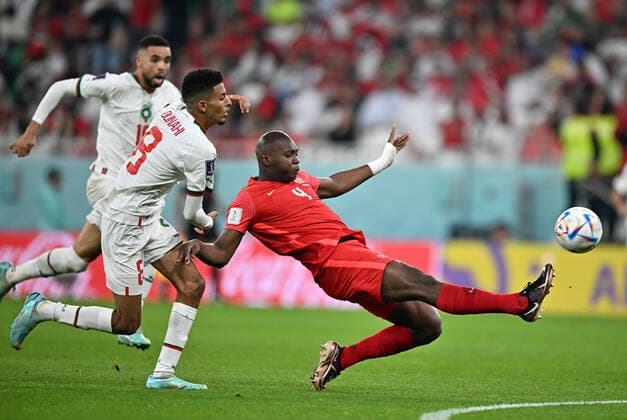 (221201) -- DOHA, Dec. 1, 2022 -- Steven Vitoria (R) of Canada vies for the ball during the Group F match between Canada and Morocco at the 2022 FIFA World Cup, WM, Weltmeisterschaft, Fussball at Al Thumama Stadium in Doha, Qatar, Dec. 1, 2022. ) (SP)QATAR-DOHA-2022 WORLD CUP-GROUP F-CAN VS MAR XinxYuewei 