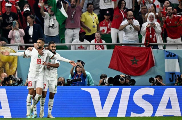 (221201) -- DOHA, Dec. 1, 2022 -- Youssef En-Nesyri (L) of Morocco celebrates after scoring team s second goal during the Group F match between Canada and Morocco at the 2022 FIFA World Cup, WM, Weltmeisterschaft, Fussball at Al Thumama Stadium in Doha, Qatar, Dec. 1, 2022. ) (SP)QATAR-DOHA-2022 WORLD CUP-GROUP F-CAN VS MAR XinxYuewei 