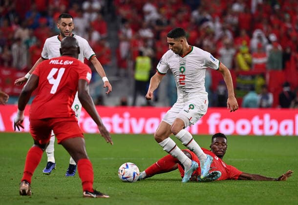 (221201) -- DOHA, Dec. 1, 2022 -- Achraf Hakimi (2nd R) of Morocco vies for the ball during the Group F match between Canada and Morocco at the 2022 FIFA World Cup, WM, Weltmeisterschaft, Fussball at Al Thumama Stadium in Doha, Qatar, Dec. 1, 2022. ) (SP)QATAR-DOHA-2022 WORLD CUP-GROUP F-CAN VS MAR ChenxCheng 